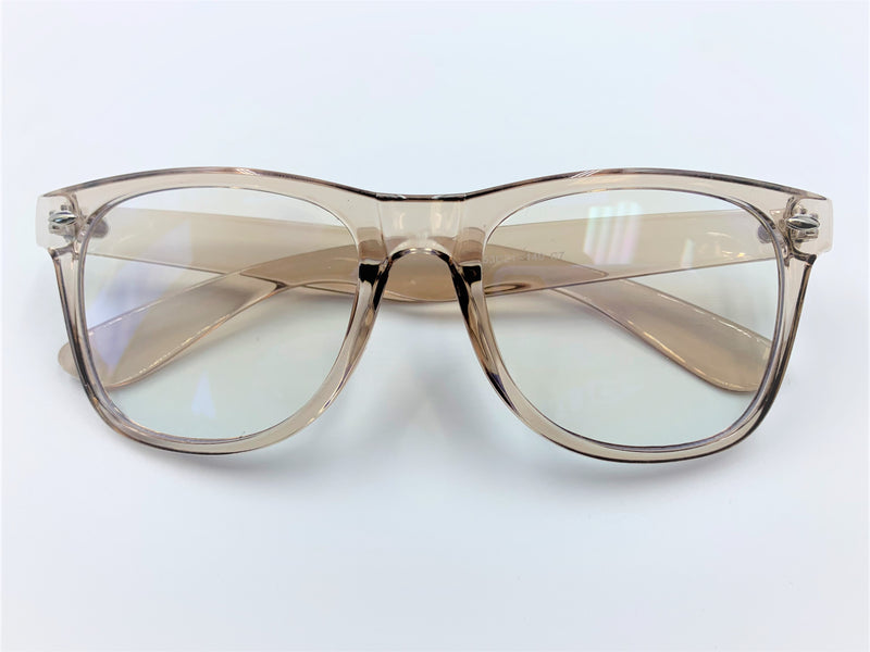 Blue light filtering glasses with translucent champagne colored frame